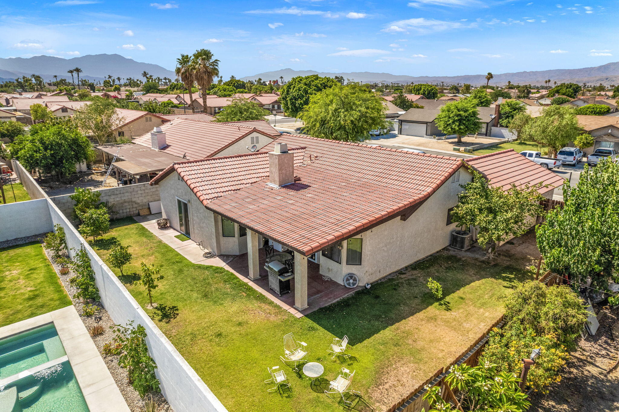 82445 Arlene Drive Indio, CA 92201 - Photo 2 of 18 a view of a swimming pool with a patio