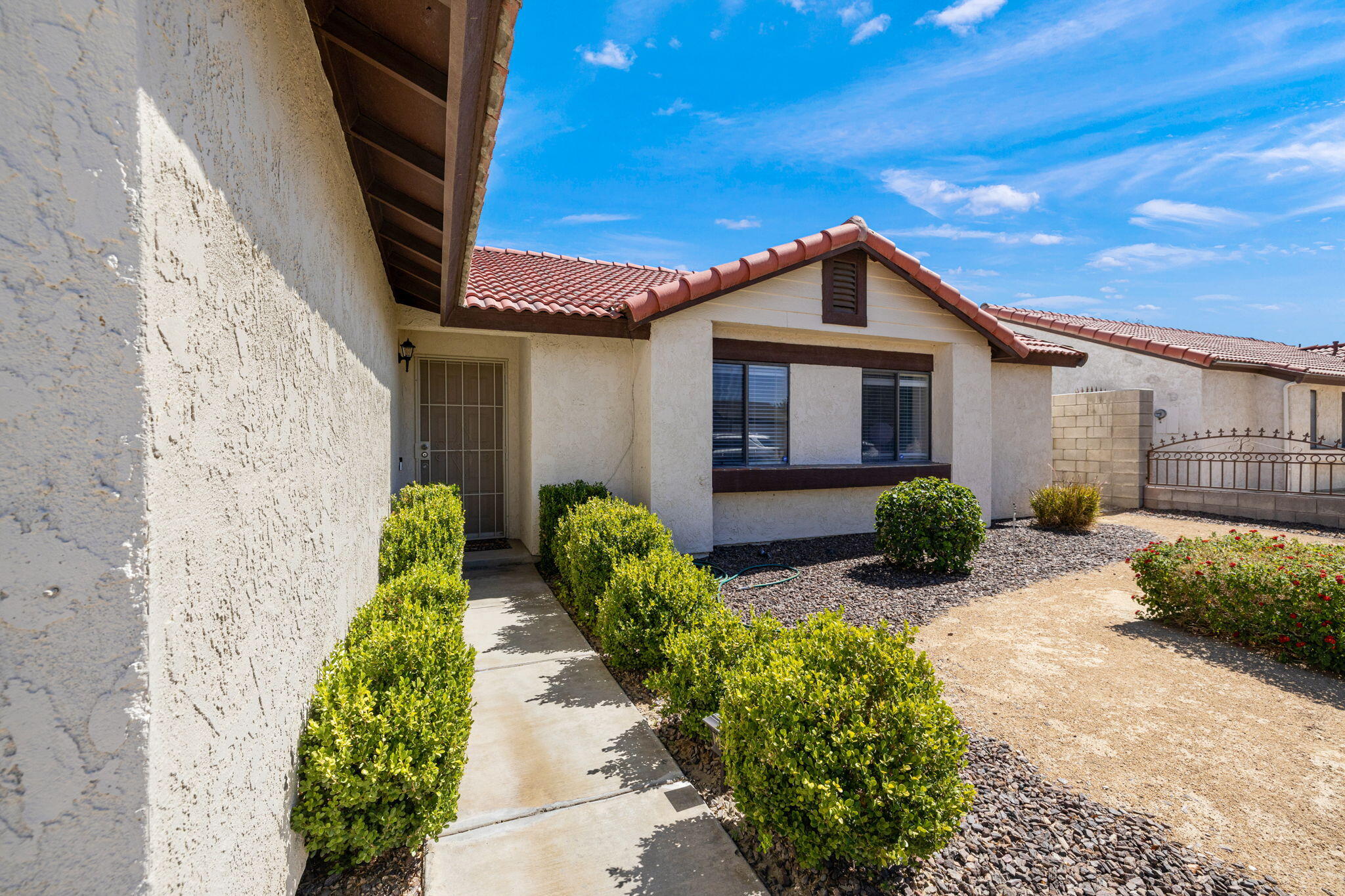 82445 Arlene Drive Indio, CA 92201 - Photo 3 of 18 a view of a house with potted plants