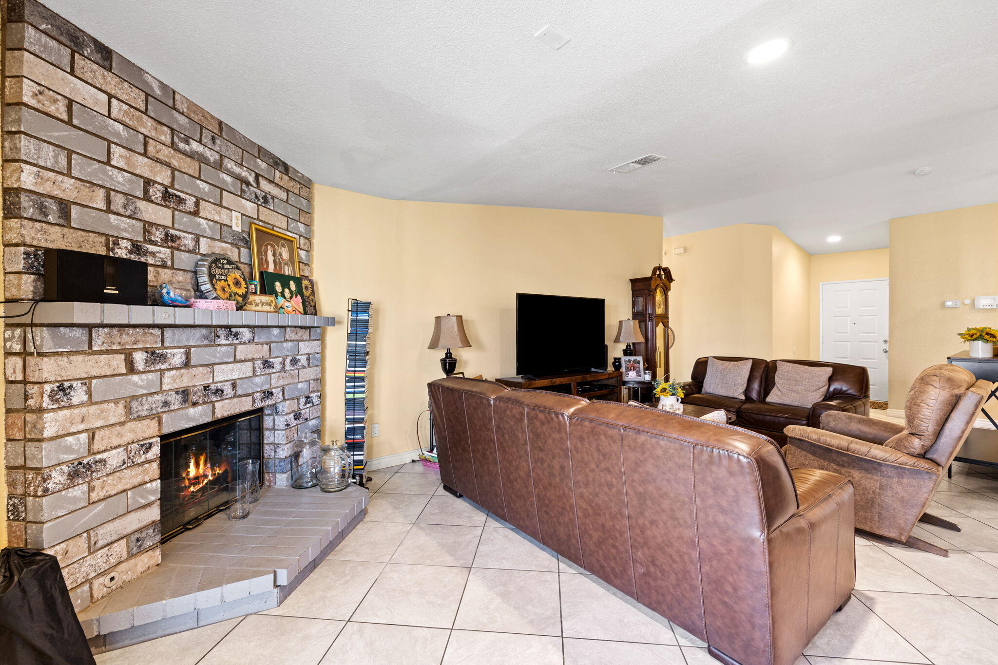 82445 Arlene Drive Indio, CA 92201 - Photo 8 of 18 a living room with furniture and a fireplace