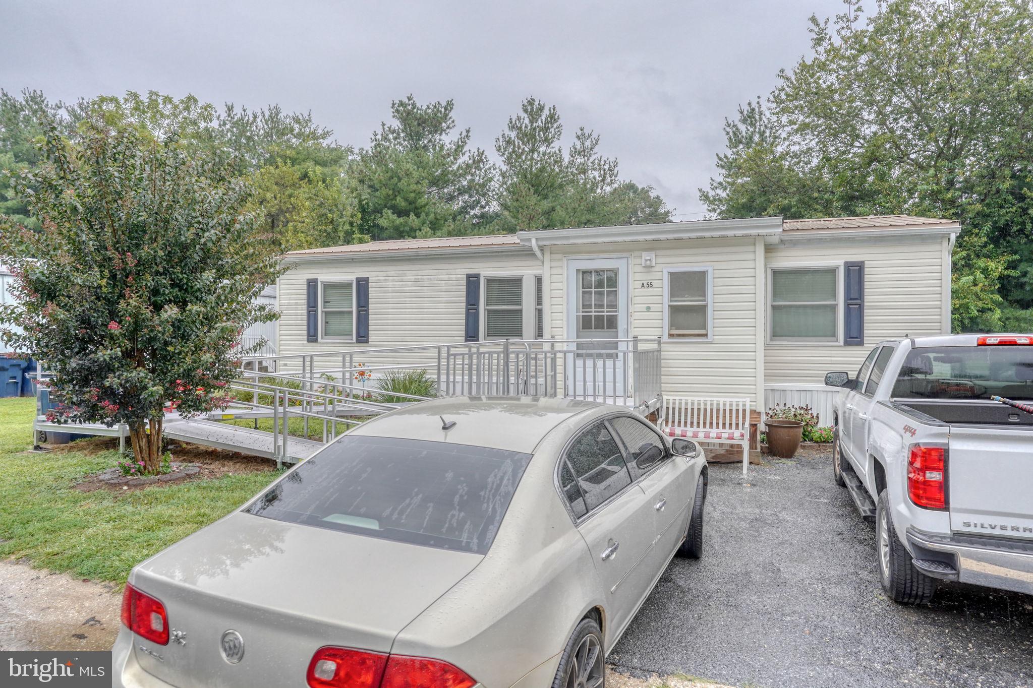 1679 South State Street, Unit A55 Dover, DE 19901 - Photo 1 of 26 a view of a house with a bed and a chairs