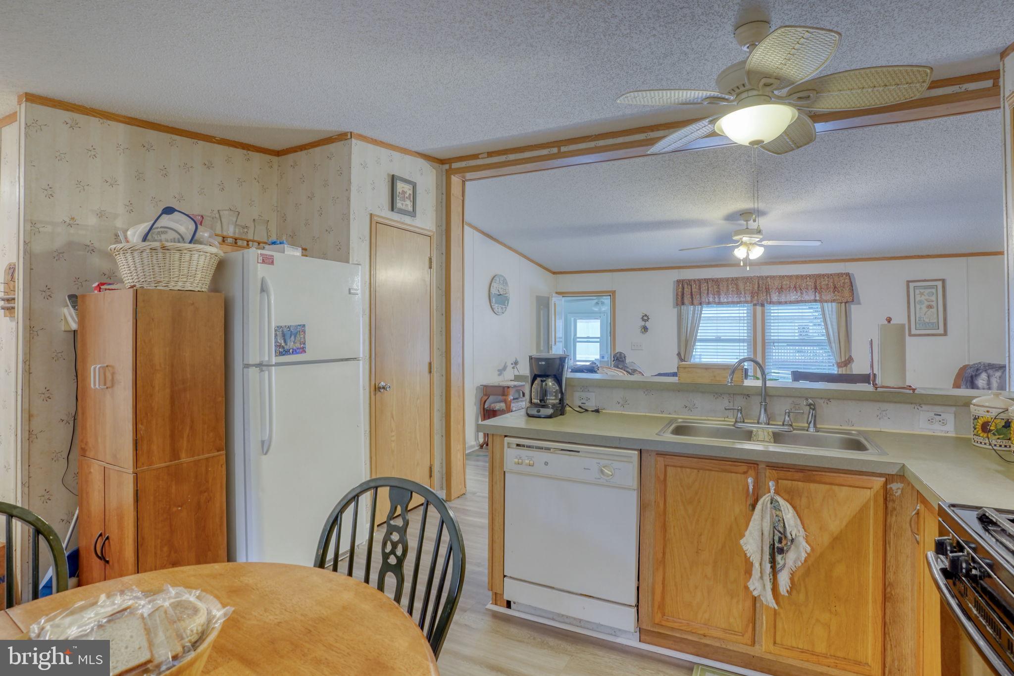 1679 South State Street, Unit A55 Dover, DE 19901 - Photo 12 of 26 a kitchen with a sink appliances and cabinets
