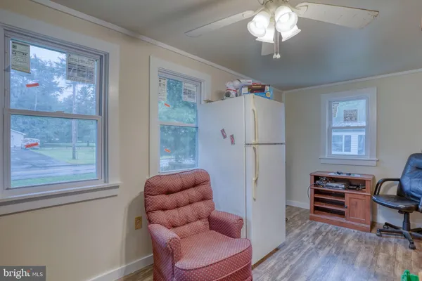 a white toilet sitting next to a bathroom sink