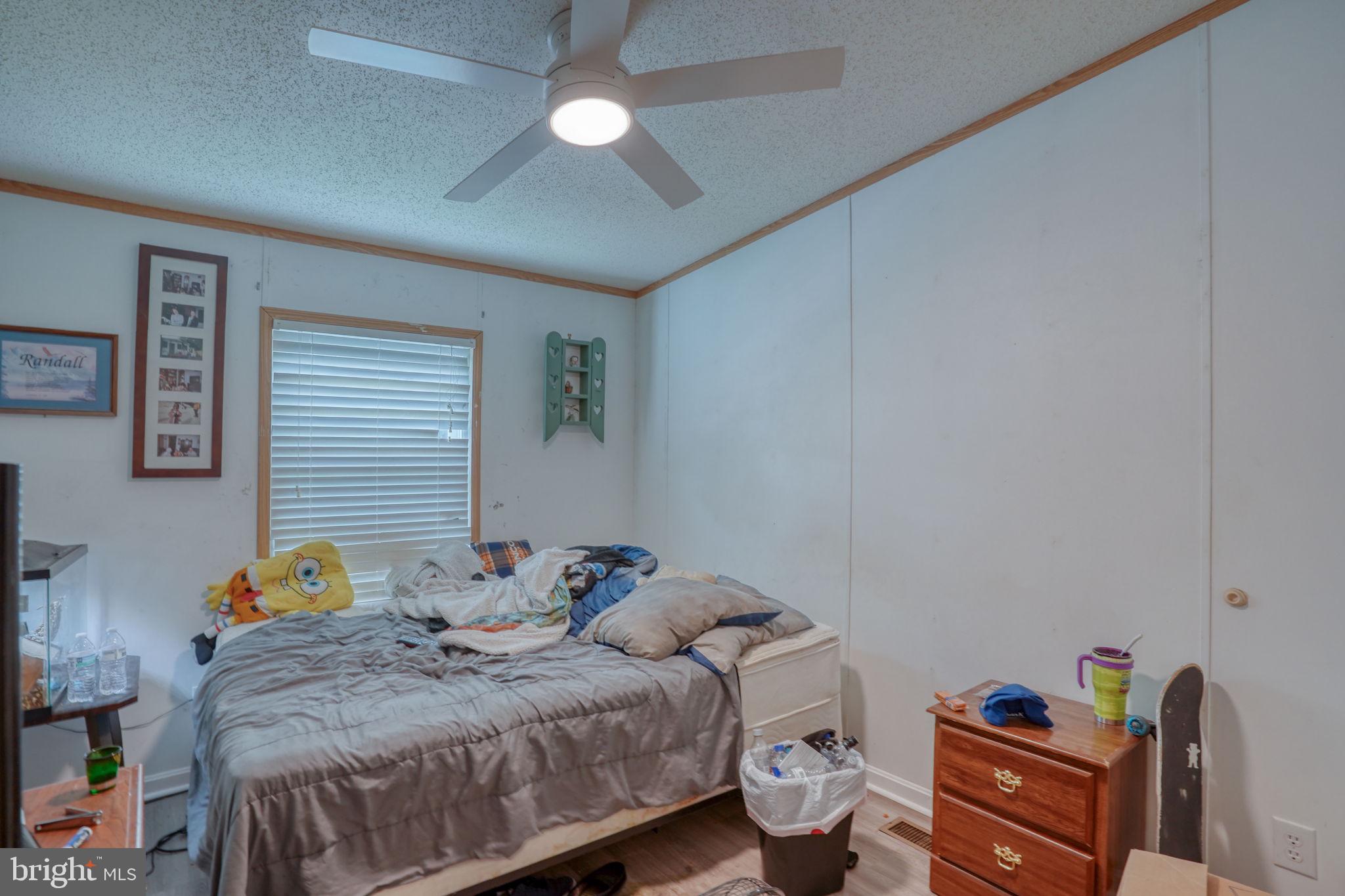 1679 South State Street, Unit A55 Dover, DE 19901 - Photo 24 of 26 a bedroom with a bed and a window