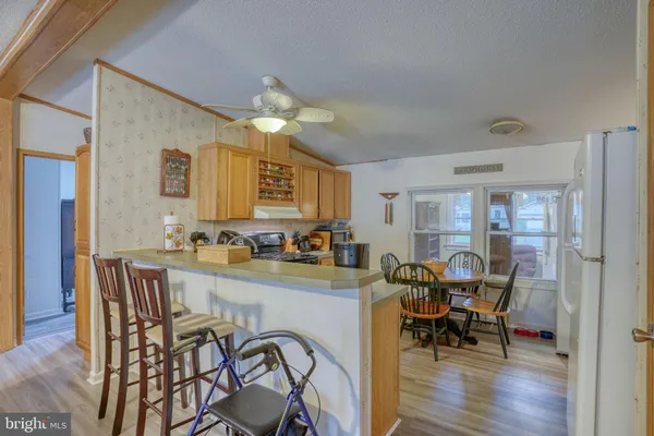 a view of a dining room with furniture and wooden floor