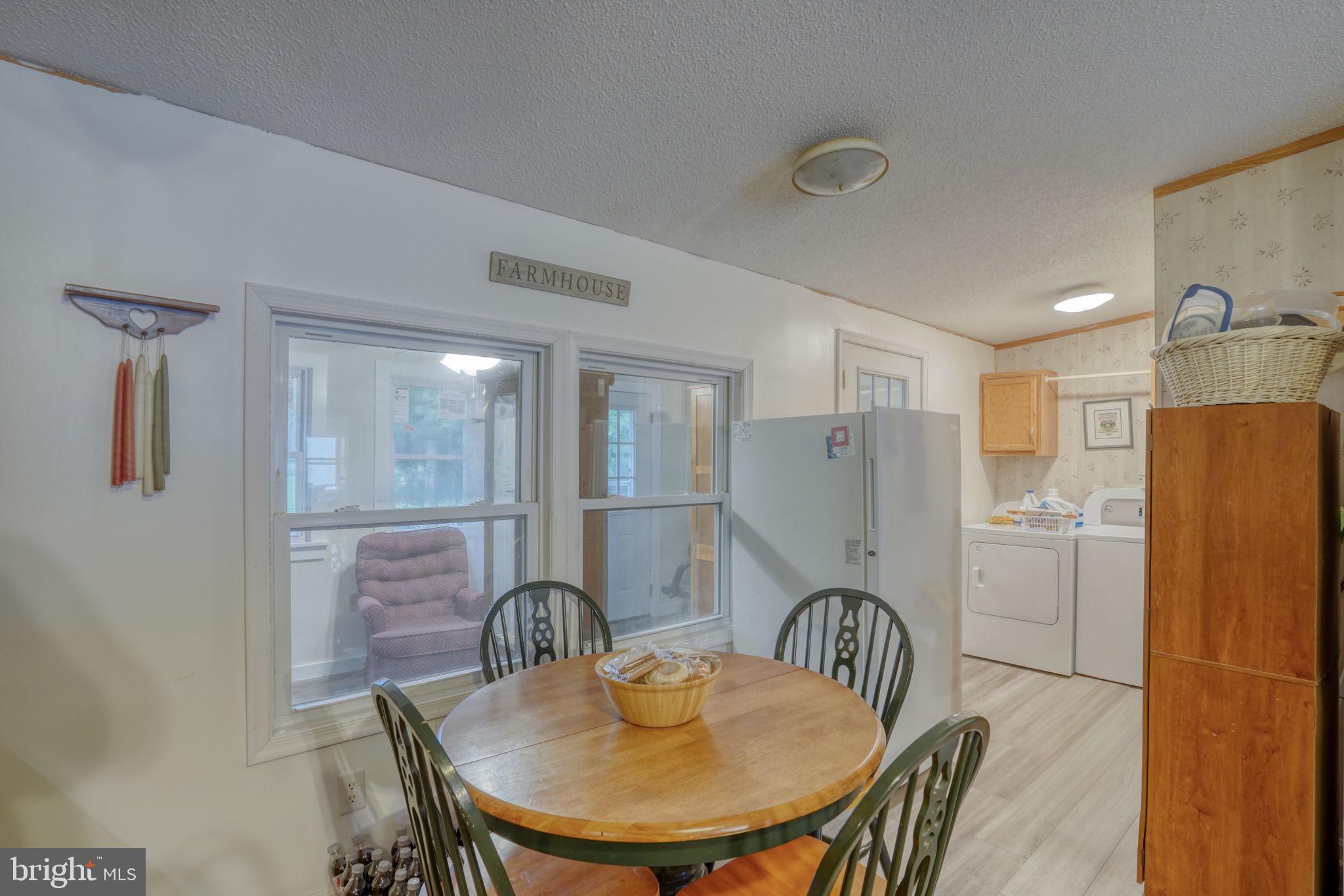 1679 South State Street, Unit A55 Dover, DE 19901 - Photo 9 of 26 a dining room with furniture and window