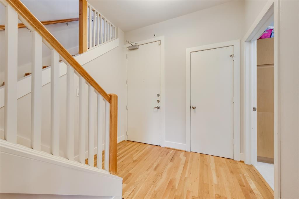 5055 Addison Circle, Unit 407 Addison, TX 75001 - Photo 2 of 22 Entry Foyer with Coat Closet and stairs to Main Level