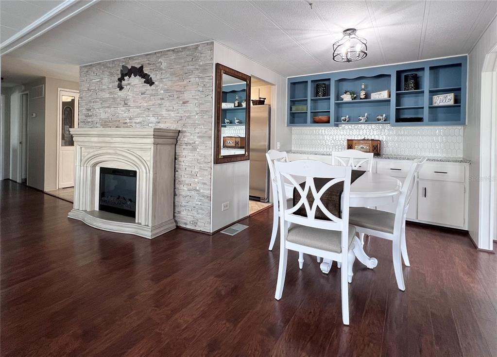 1100 South Belcher Road, Unit 772 Largo, FL 33771 - Photo 11 of 84 a kitchen with wooden floors and breakfast area