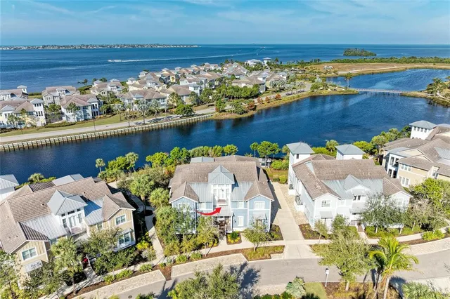 a living room with lots of furniture and kitchen view