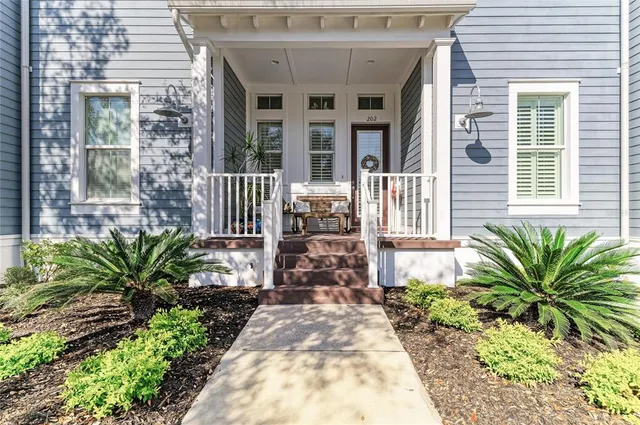 a kitchen with stainless steel appliances granite countertop a stove a sink dishwasher and a refrigerator