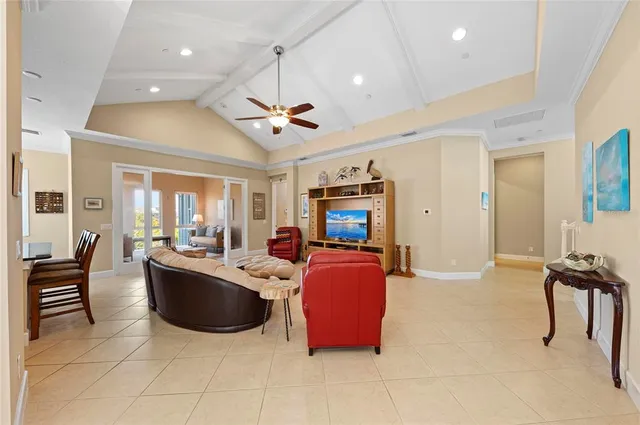 a bedroom with a bed couch and window