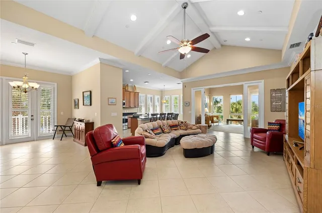 a bed room with a bed and a chandelier