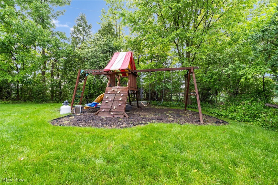 2524 Claver Road Cleveland, OH 44118 - Photo 50 of 50 View of playground featuring a lawn and central air condition unit