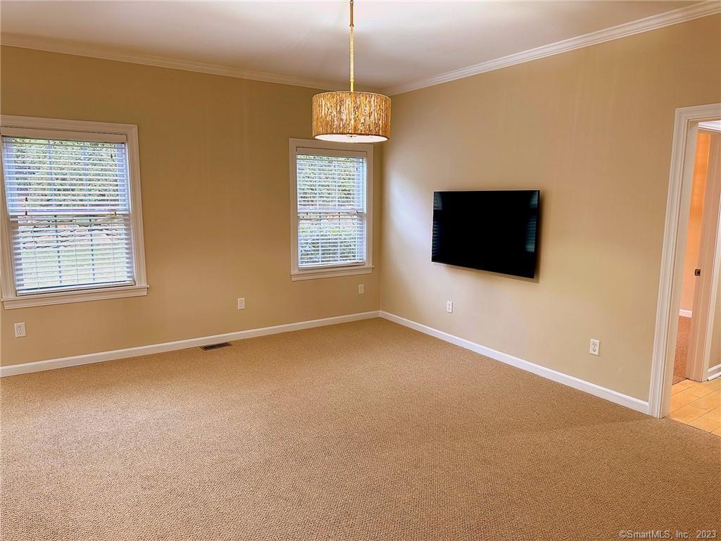 38 Canfield Drive Shelton, CT 06484 - Photo 14 of 29 a view of an empty room with a window and a kitchen