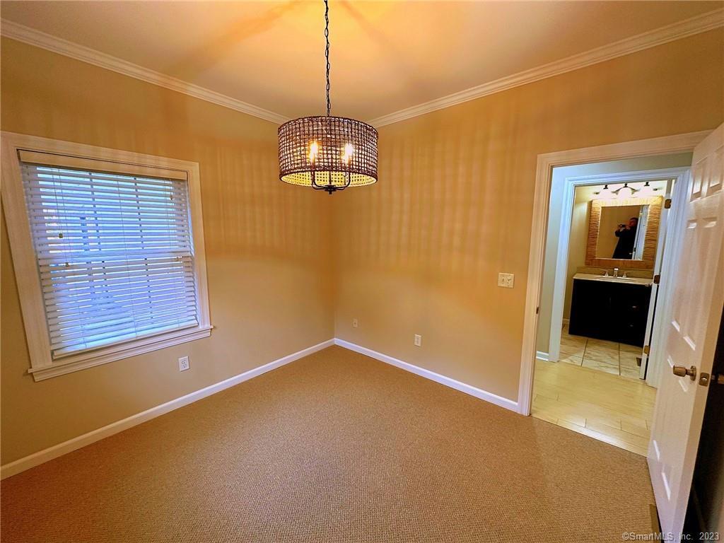 38 Canfield Drive Shelton, CT 06484 - Photo 26 of 29 a view of an empty room with a window