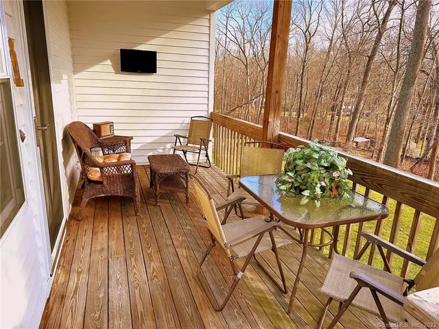 a view of a chairs and table on the deck