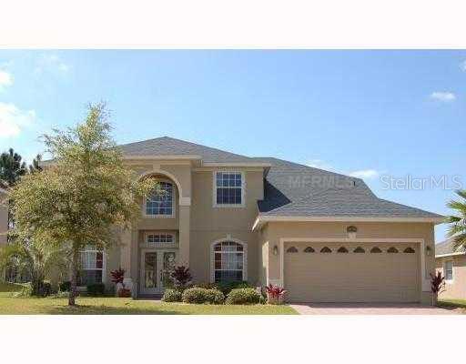 3779 Beacon Ridge Way Clermont, FL 34711 - Photo 1 of 1 a front view of a house with a yard