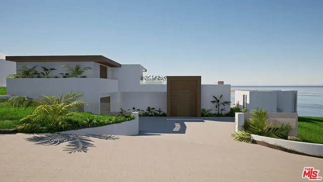 a front view of a house with a yard and outdoor seating