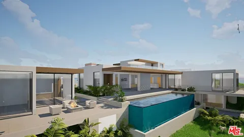 a view of a house with a yard deck and furniture