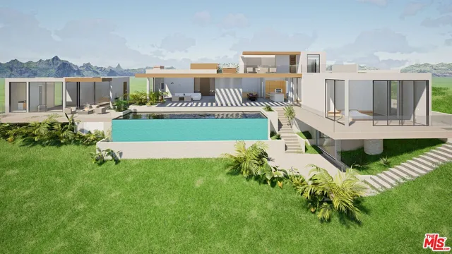 an aerial view of a residential apartment building with a yard