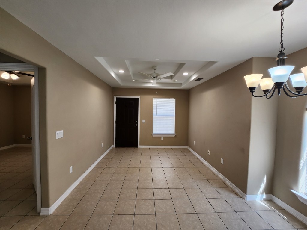 a view of an empty room with glass door