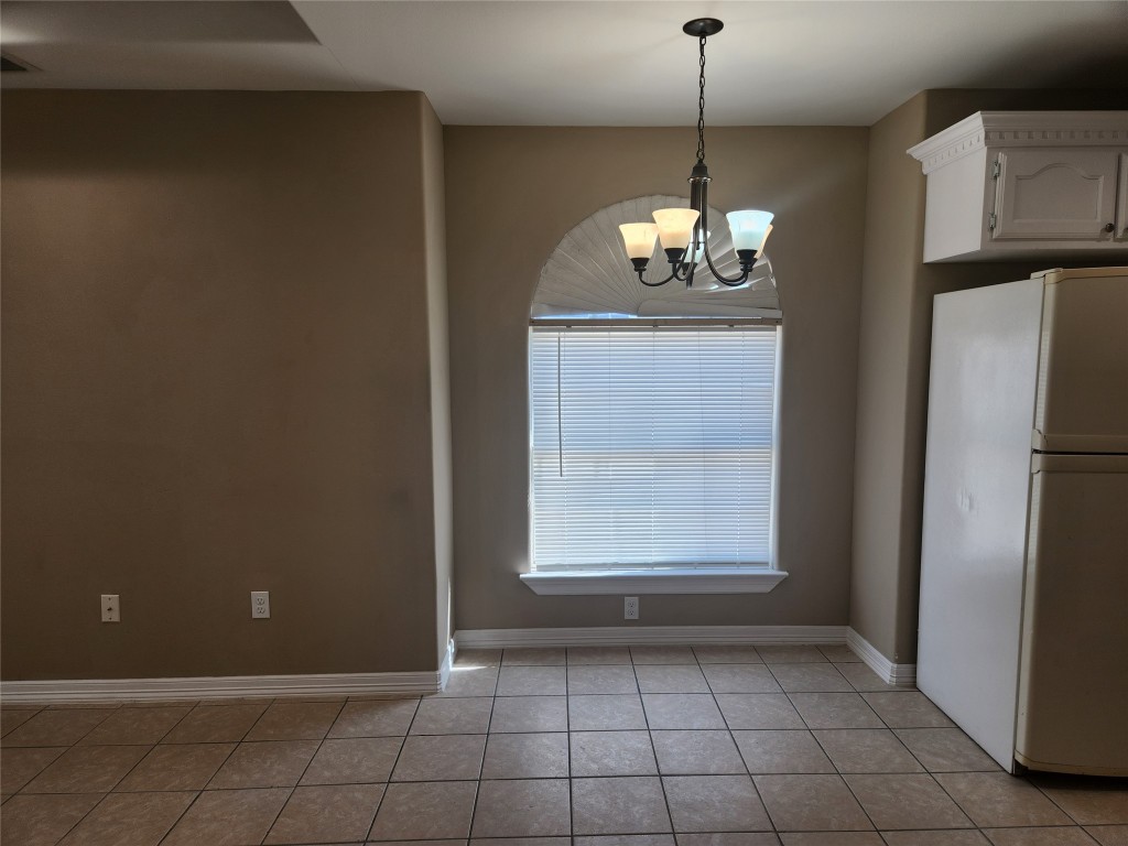 7609 Villa Rama S Street, Unit 4 Mission, TX 78572 - Photo 3 of 11 a view of a kitchen with a dishwasher cabinets and a window