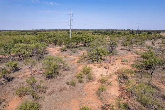 an aerial view of houses with yard