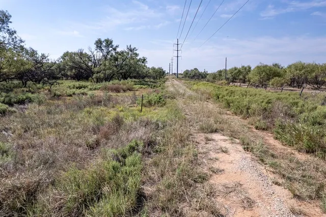 a view of a lake with a house in background