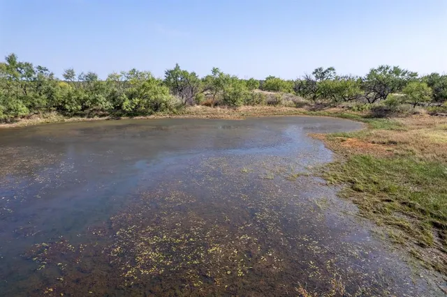 a view of a road with a yard