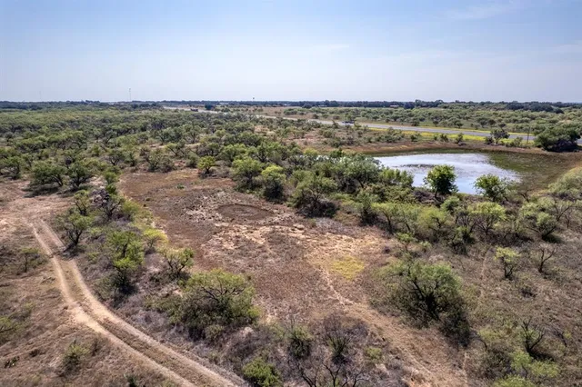 a view of a lake with tall buildings in the background
