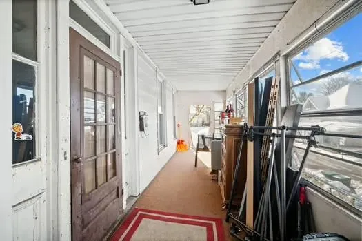 a view of entryway with wooden floor