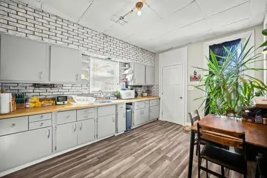 a kitchen with a table and chairs in it