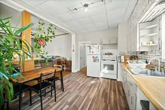 a view of a kitchen with furniture and a kitchen