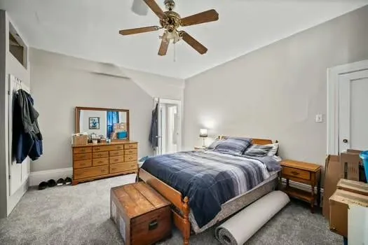 a bedroom with a bed and furniture