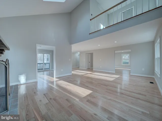 a view of front door with wooden floor