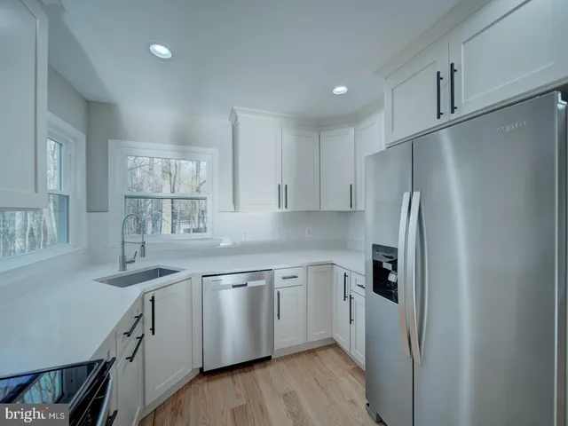 a view of an empty room and a windows