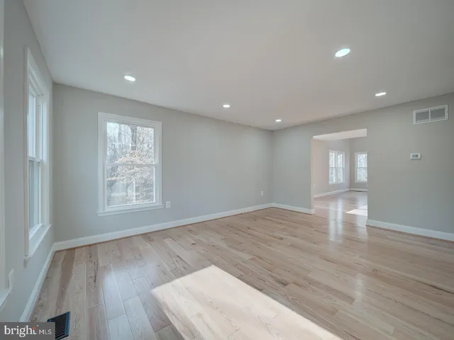 a view of an empty room and closet