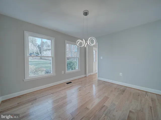 a view of a house with a yard and garage