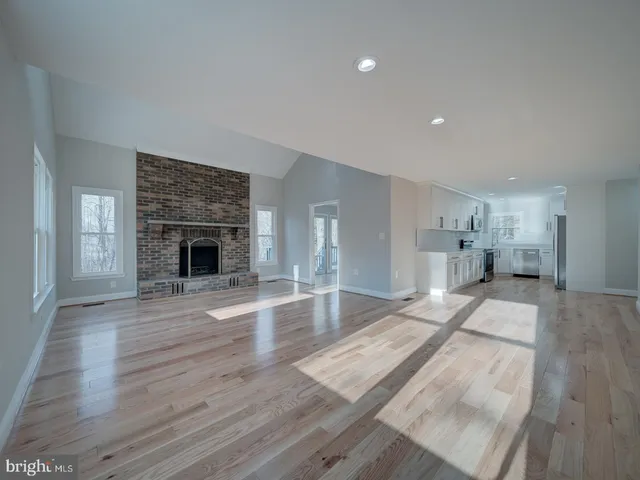 a view of an entryway with wooden floor