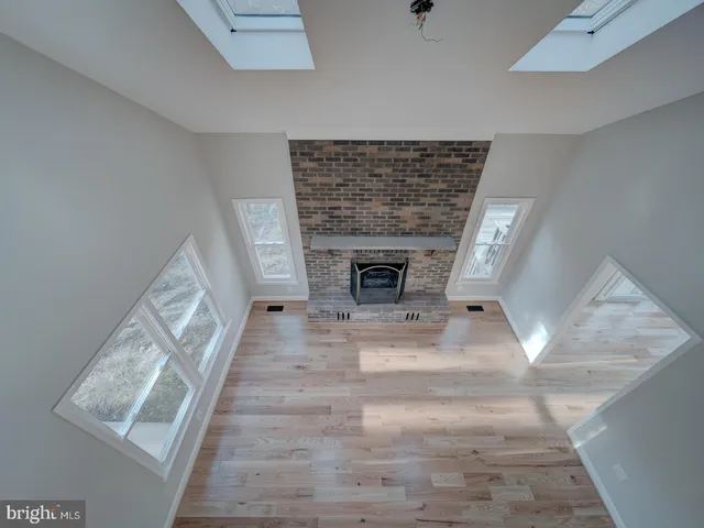 a kitchen with stainless steel appliances a sink stove and microwave