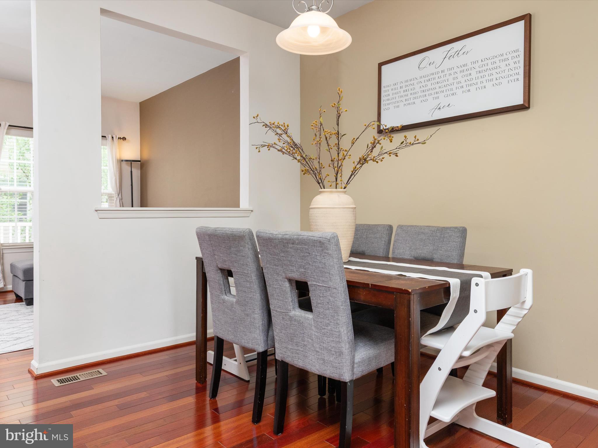 6888 Tasker Falls Elkridge, MD 21075 - Photo 16 of 47 a view of a dining room with furniture and wooden floor