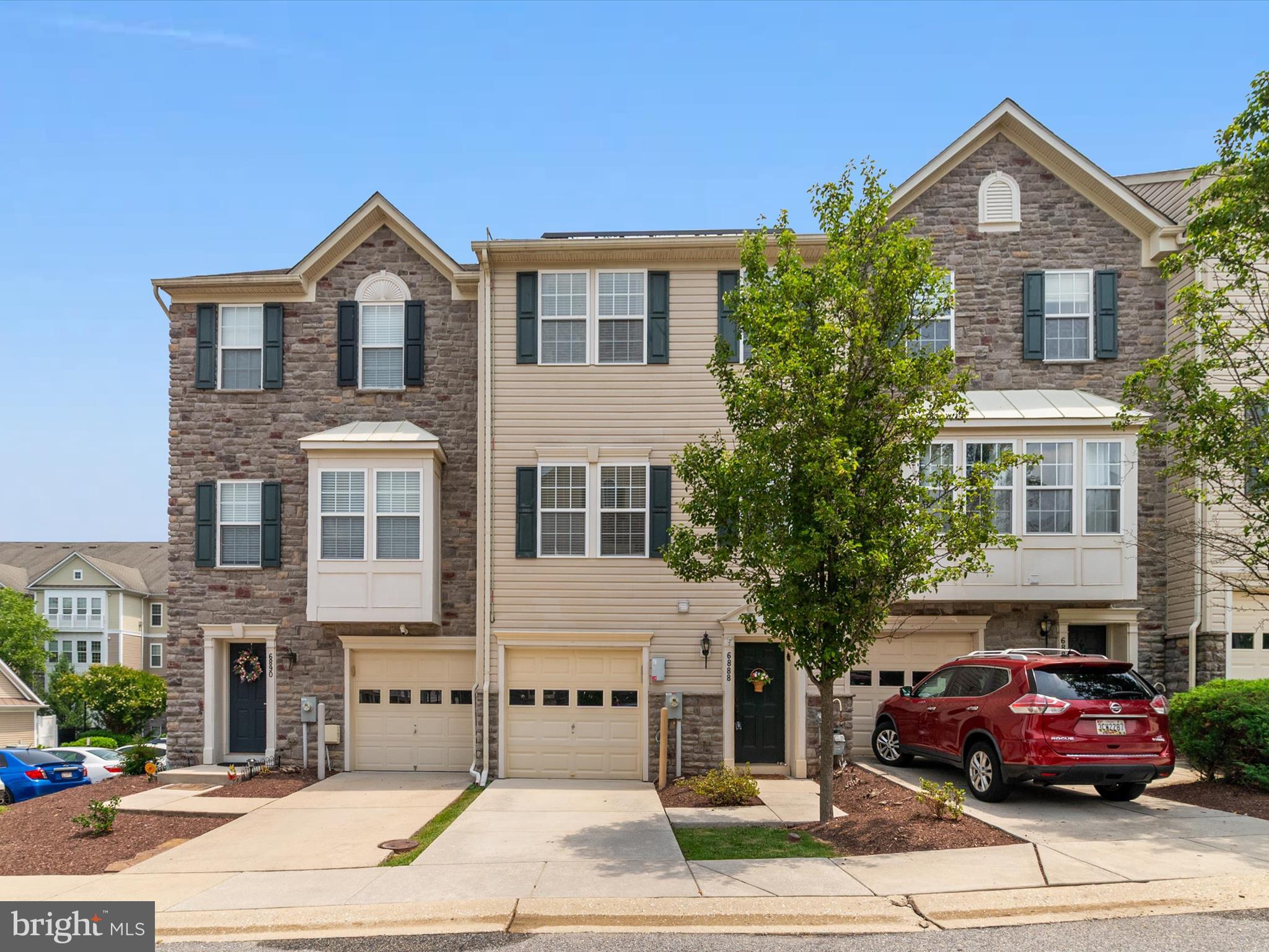 6888 Tasker Falls Elkridge, MD 21075 - Photo 2 of 47 a front view of a house with a yard