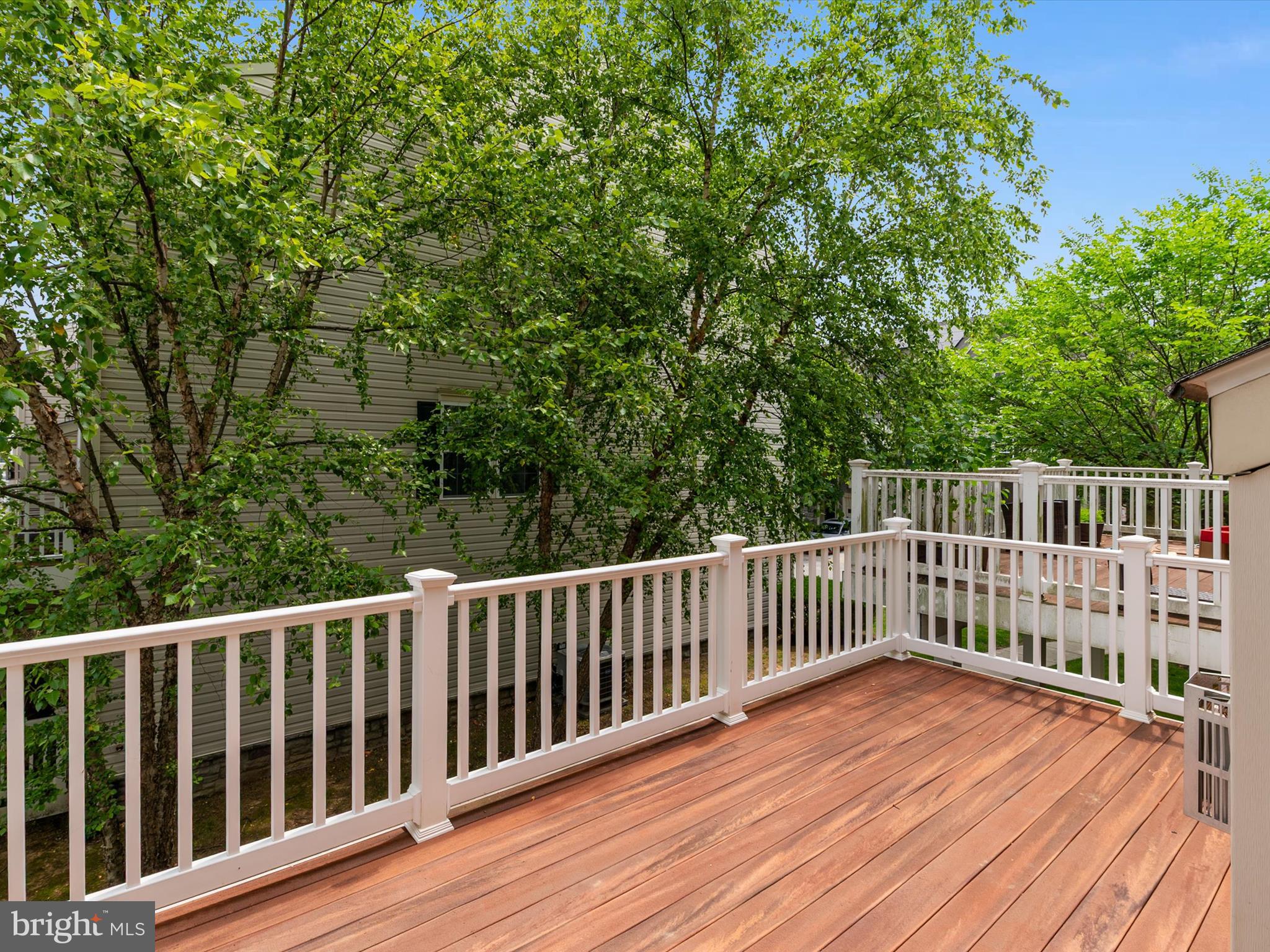 6888 Tasker Falls Elkridge, MD 21075 - Photo 25 of 47 a view of deck with wooden floor and fence