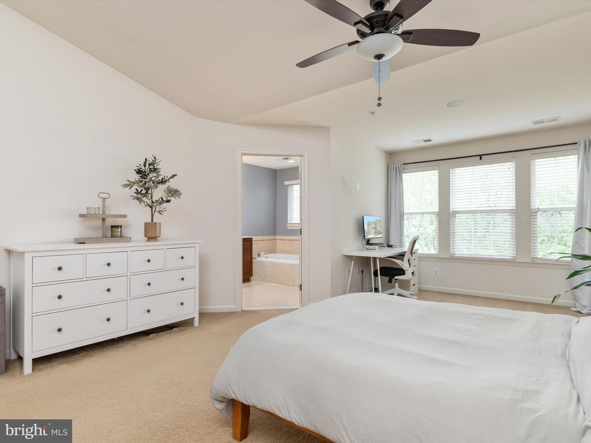 6888 Tasker Falls Elkridge, MD 21075 - Photo 29 of 47 a bedroom with a bed and a dresser