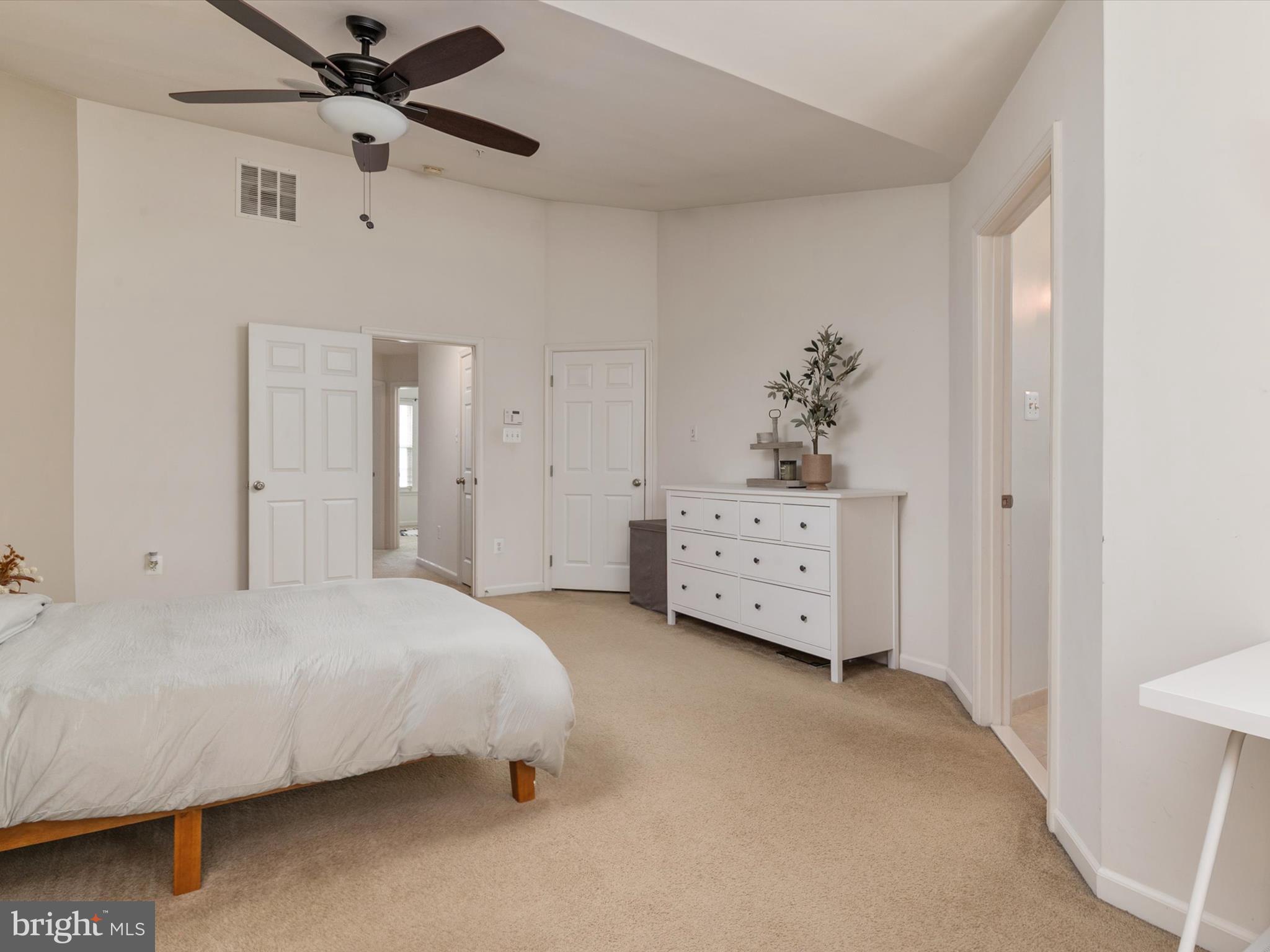 6888 Tasker Falls Elkridge, MD 21075 - Photo 30 of 47 a bedroom with a bed dresser and a window