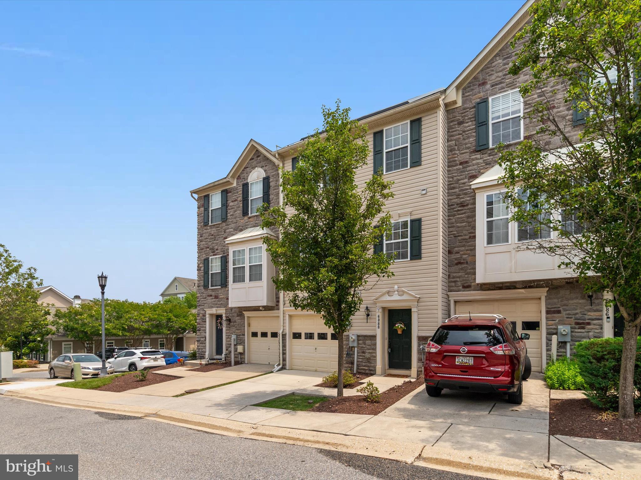 6888 Tasker Falls Elkridge, MD 21075 - Photo 3 of 47 a front view of a house with cars parked