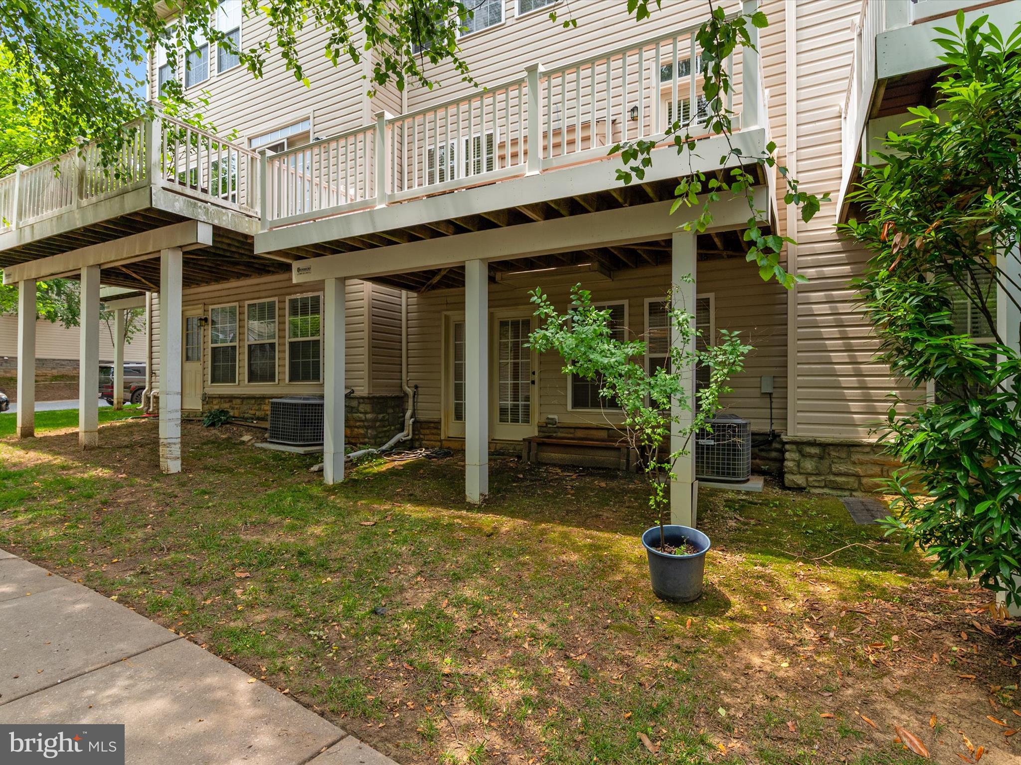 6888 Tasker Falls Elkridge, MD 21075 - Photo 38 of 47 a view of a house with backyard porch and sitting area