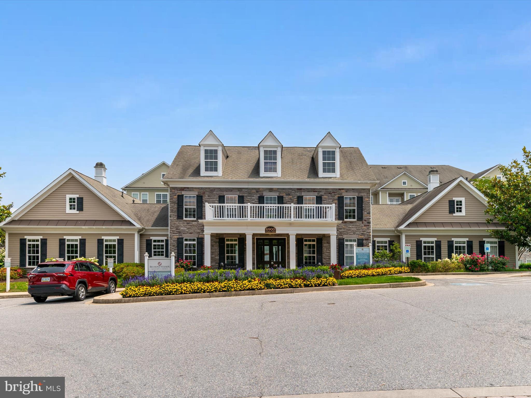 6888 Tasker Falls Elkridge, MD 21075 - Photo 41 of 47 a front view of a house with a yard and car parked