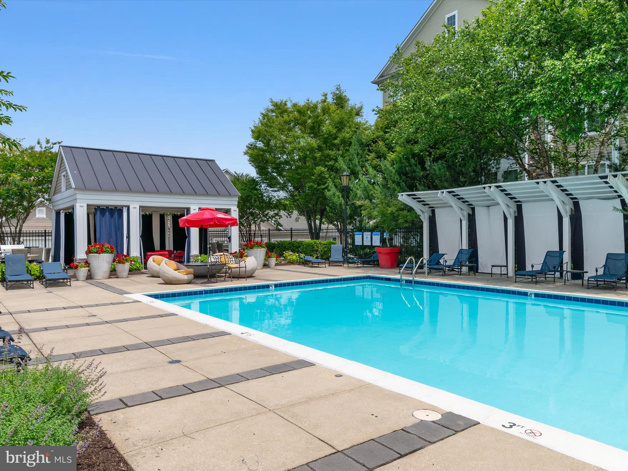 6888 Tasker Falls Elkridge, MD 21075 - Photo 44 of 47 a view of a house with pool and chairs