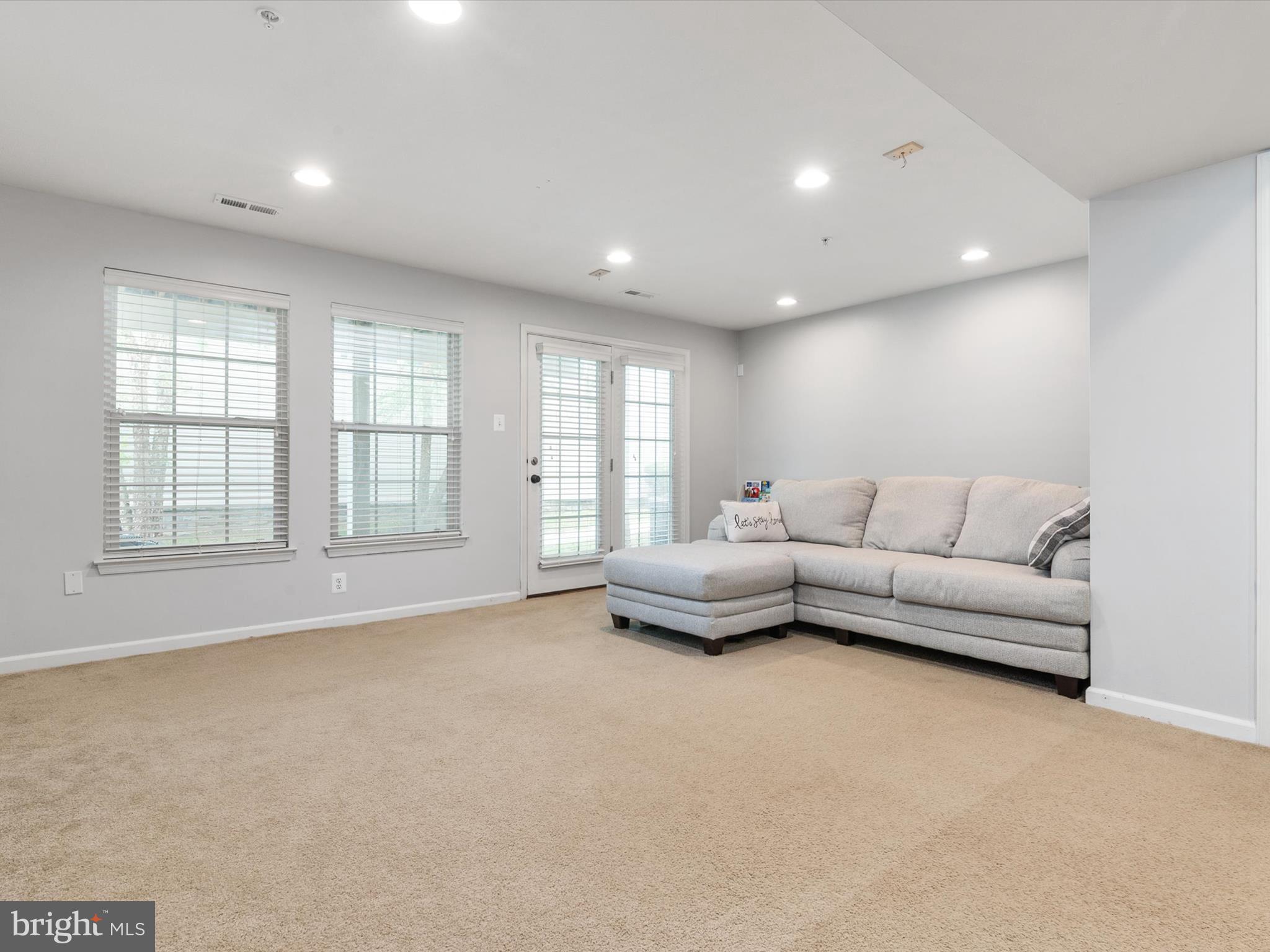 6888 Tasker Falls Elkridge, MD 21075 - Photo 9 of 47 a living room with furniture and a large window
