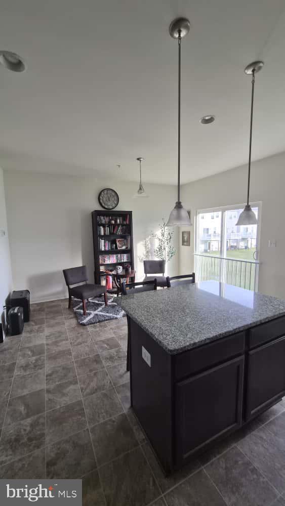 2488 Westwind Boulevard Cambridge, MD 21613 - Photo 14 of 32 a kitchen with a stove and a wooden floor